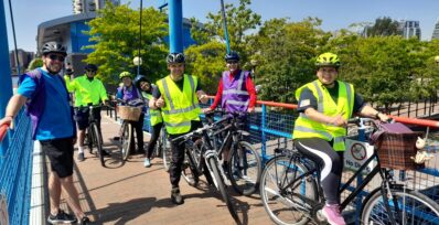 Image shows several people on bikes, including Don and his wife Chris